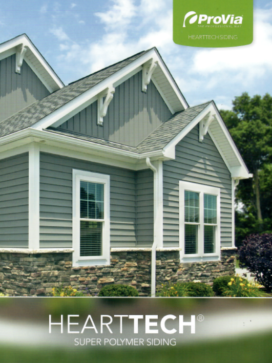 House exterior with gray siding, stone base, white trim, and the ProVia HeartTech logo.