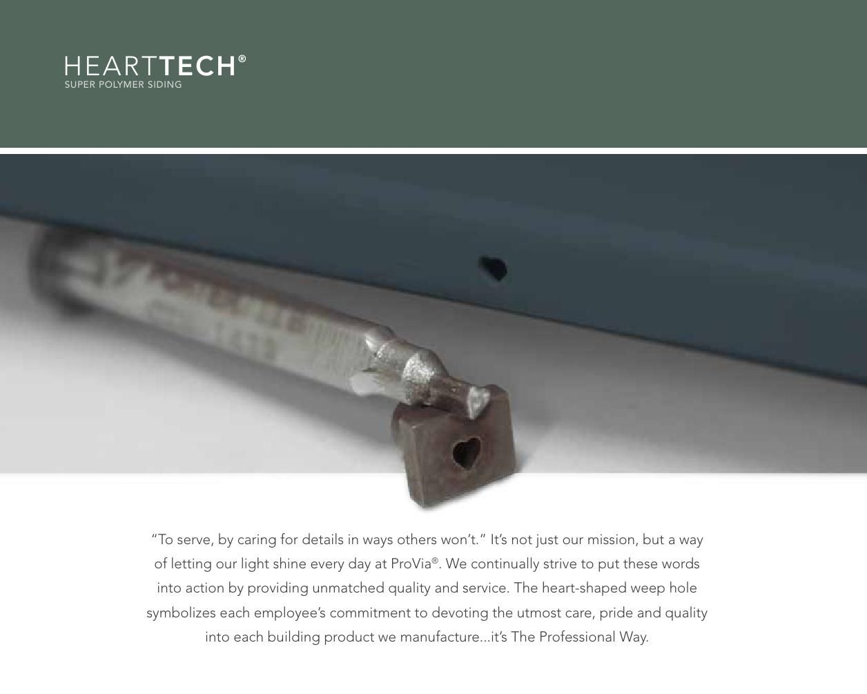 A metal tool, with a heart-shaped hole, rests against a gray surface.