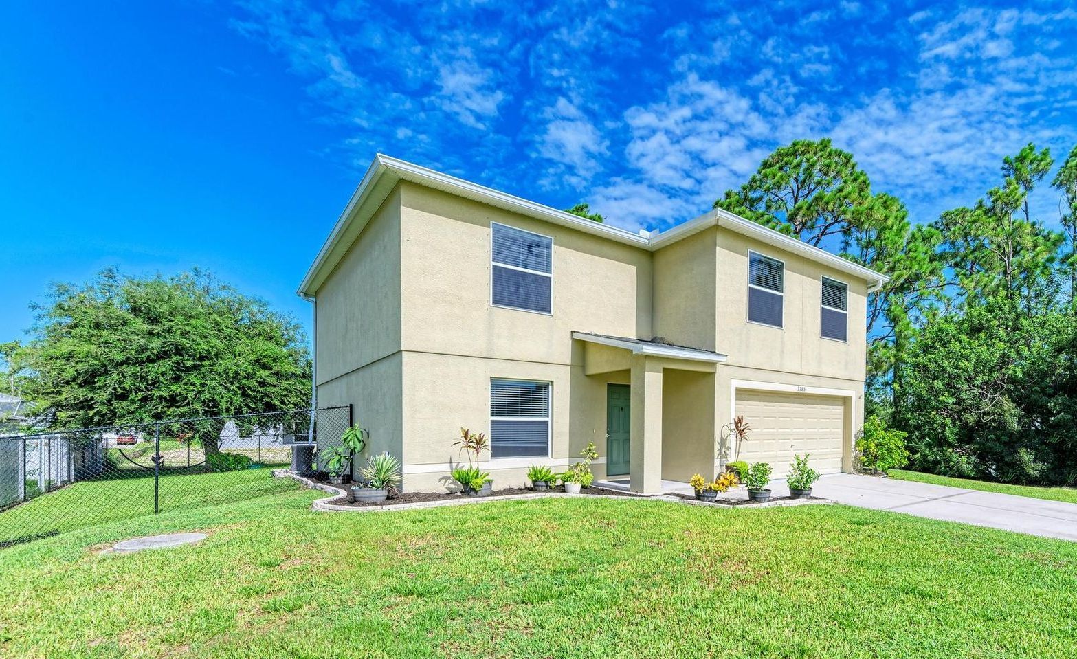 A large house with a large lawn in front of it.