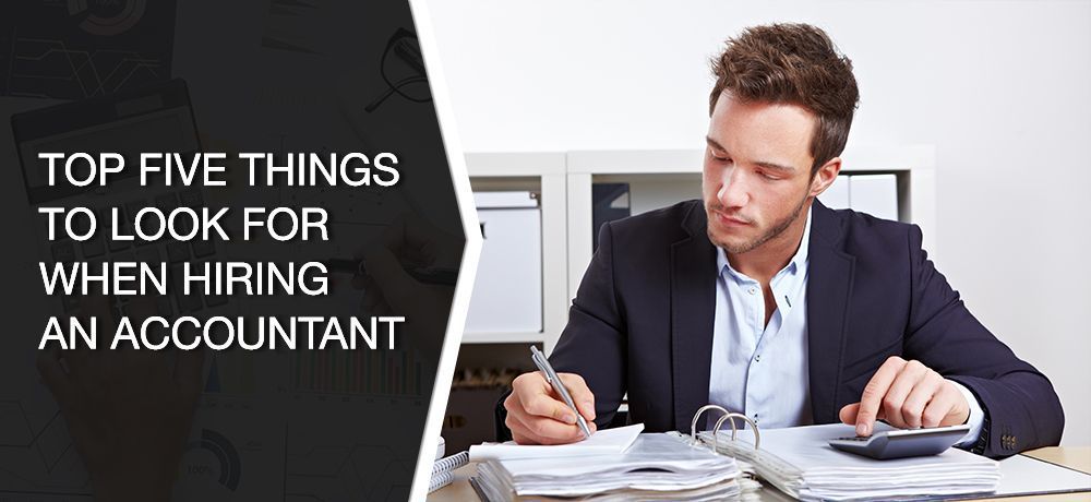 A man in a suit is working with paperwork and a calculator. Text reads: