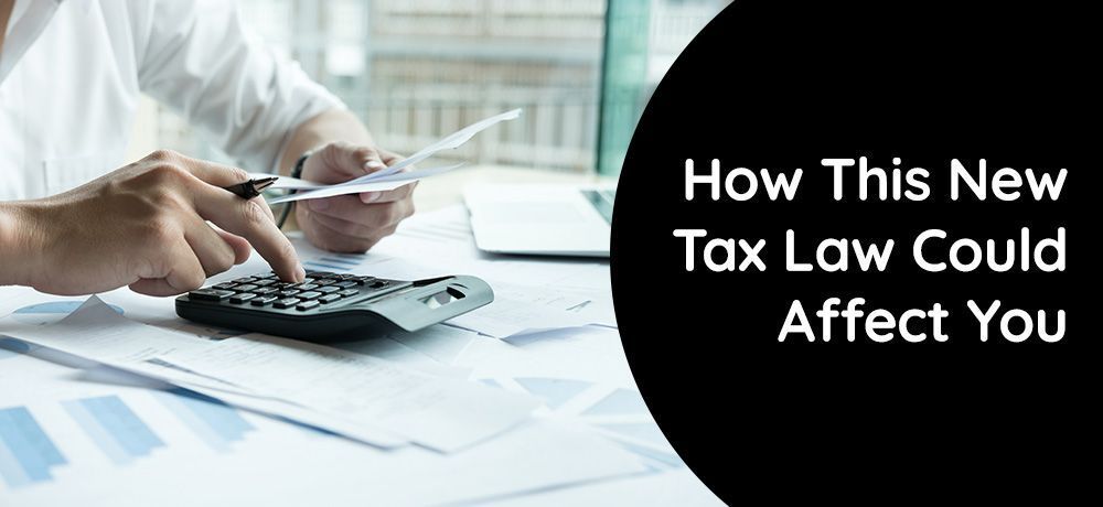 Person calculating taxes with calculator and papers. Text overlay: