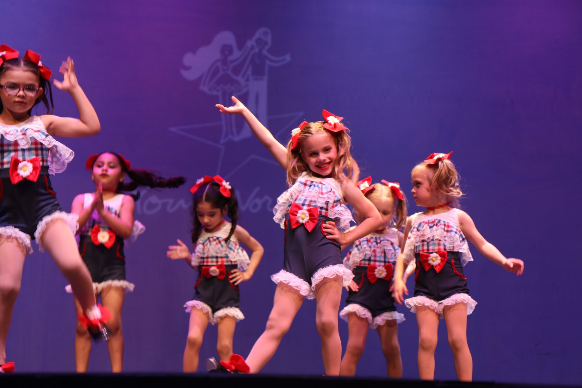 Group Of Cute Little Girls Dancing On Stage — Wichita, KS — Young World Dance Studio