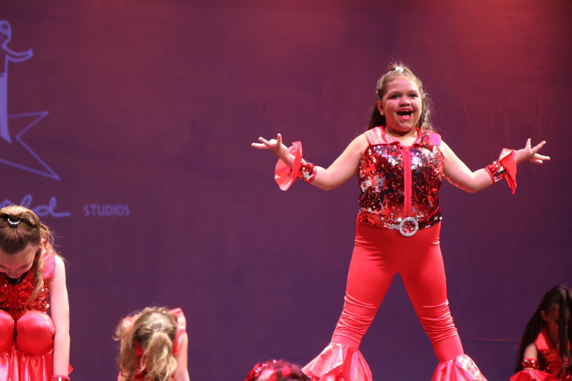 A Cute Red Girl Stand On The Stage — Wichita, KS — Young World Dance Studio