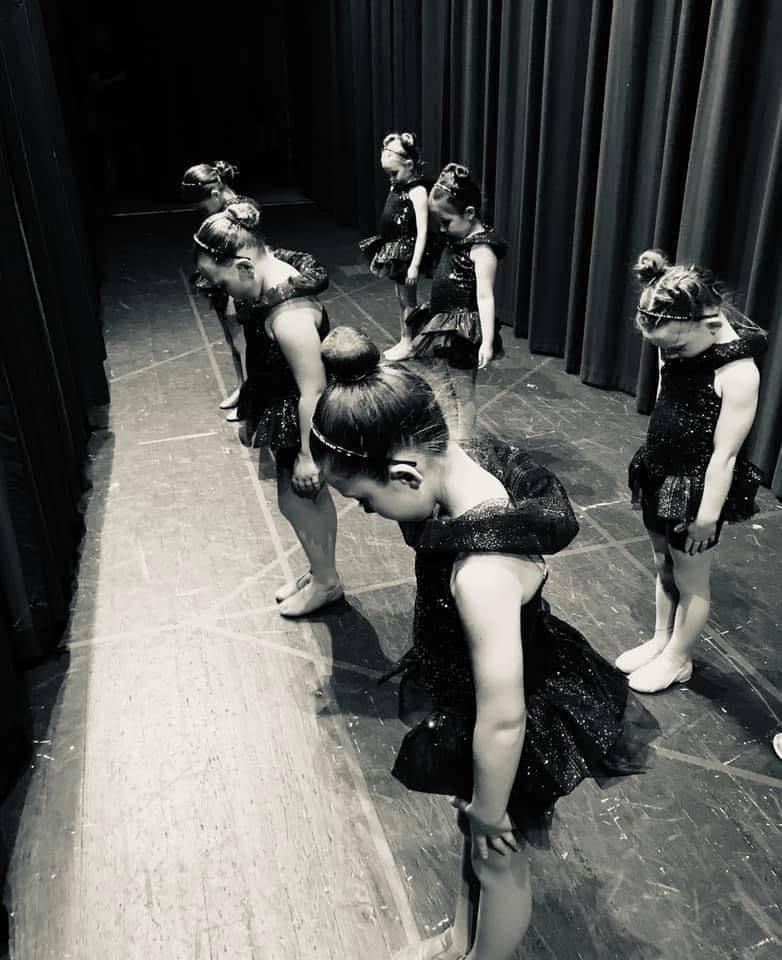 A Group Of Girl Behind The Theater Curtain — Wichita, KS — Young World Dance Studio