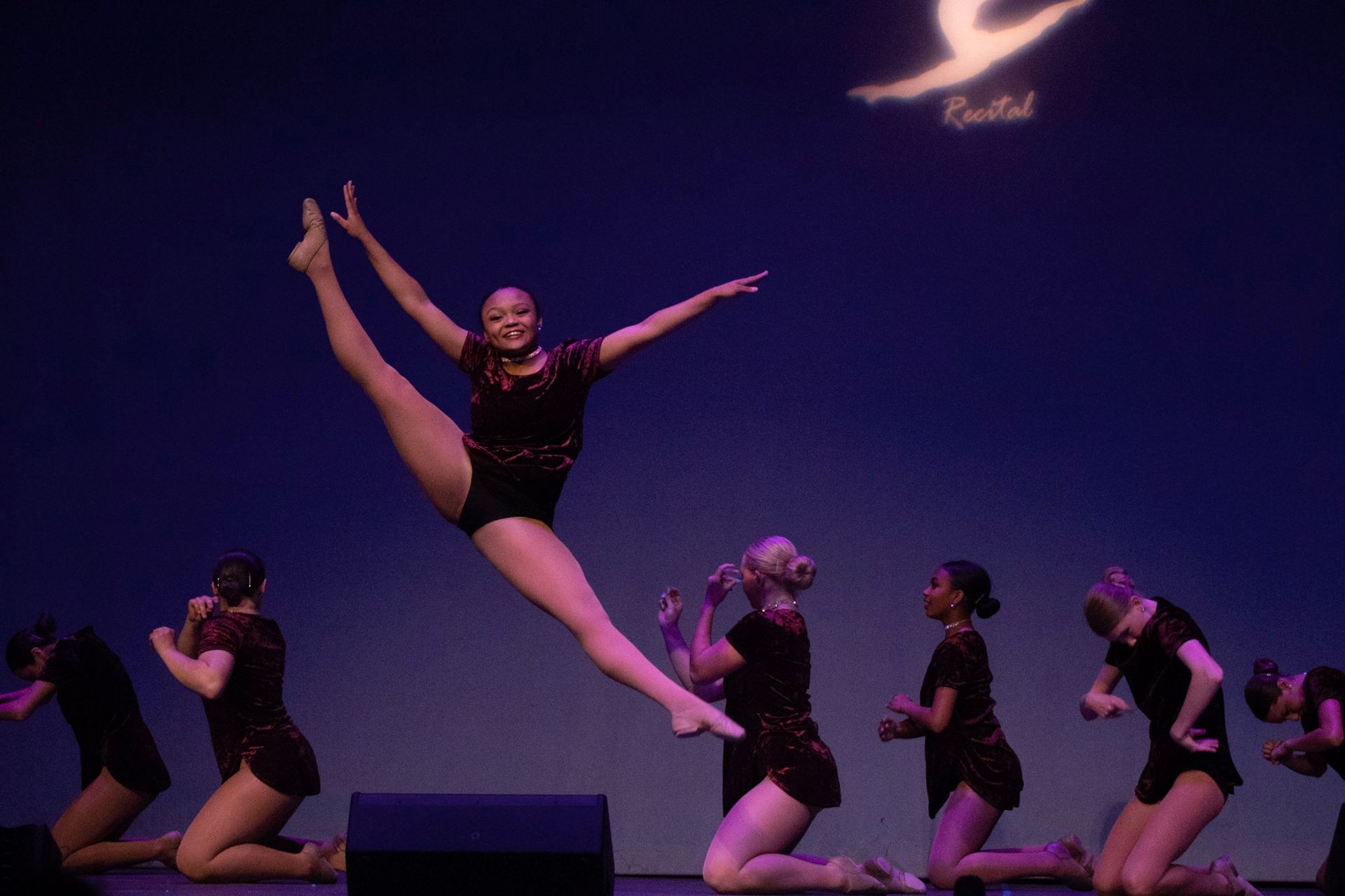A Girl Jumping While Stretching Her Feet Upward — Wichita, KS — Young World Dance Studio