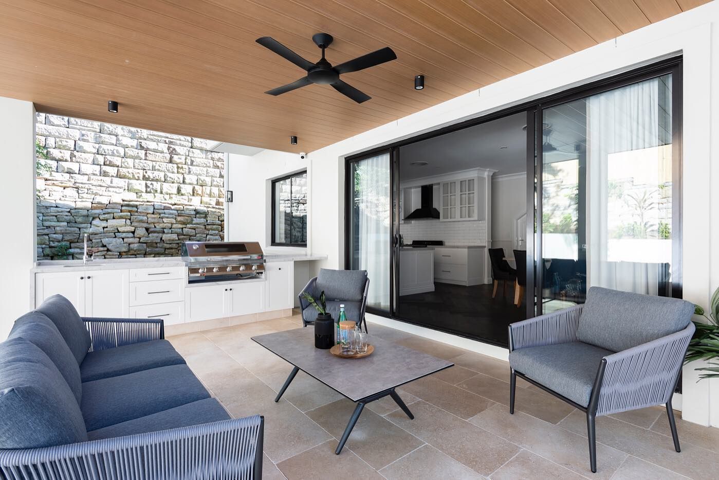 A Living Room With A Couch, Chairs, Table And Ceiling Fan — Amber North Coast In Port Macquarie, NSW