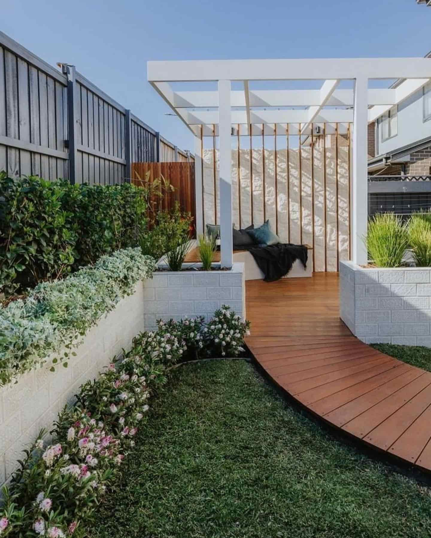 There Is A Wooden Walkway Leading To A Pergola In The Backyard — Amber North Coast In Port Macquarie, NSW