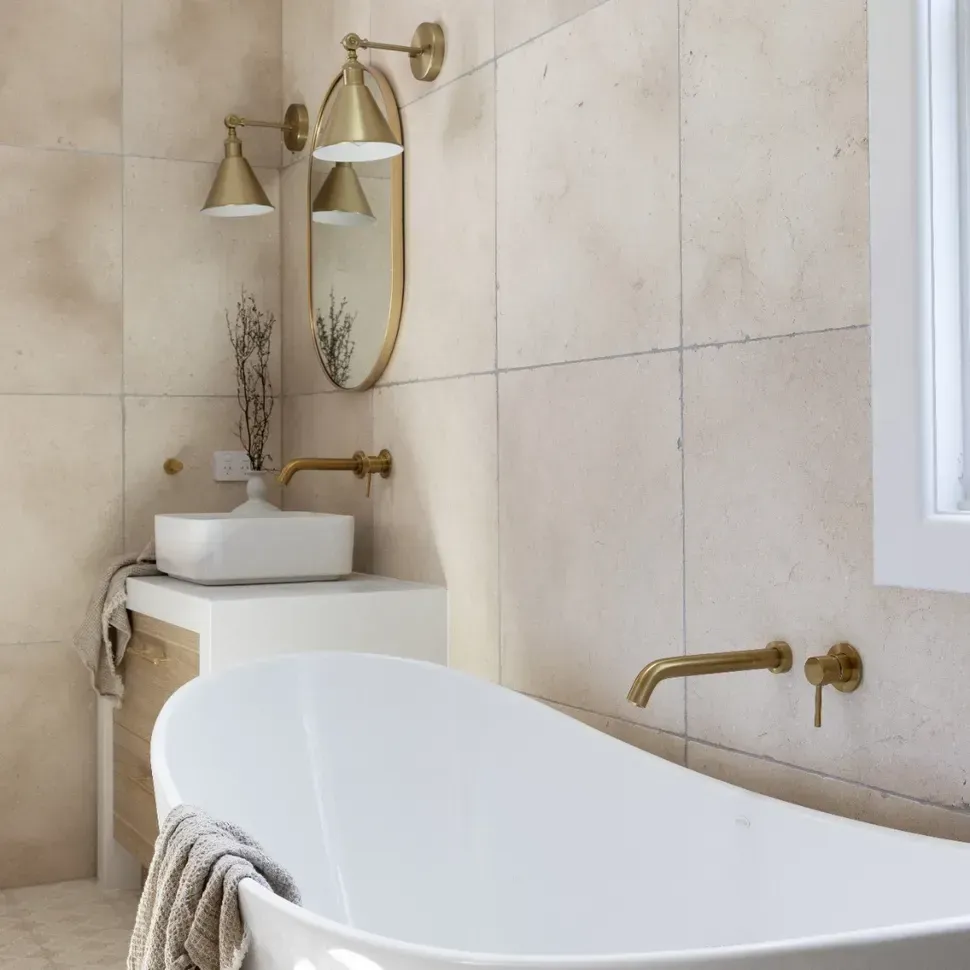 A Bathroom With A Bathtub With A Basin And A Vase With Flowers In It — Amber North Coast In Port Macquarie, NSW