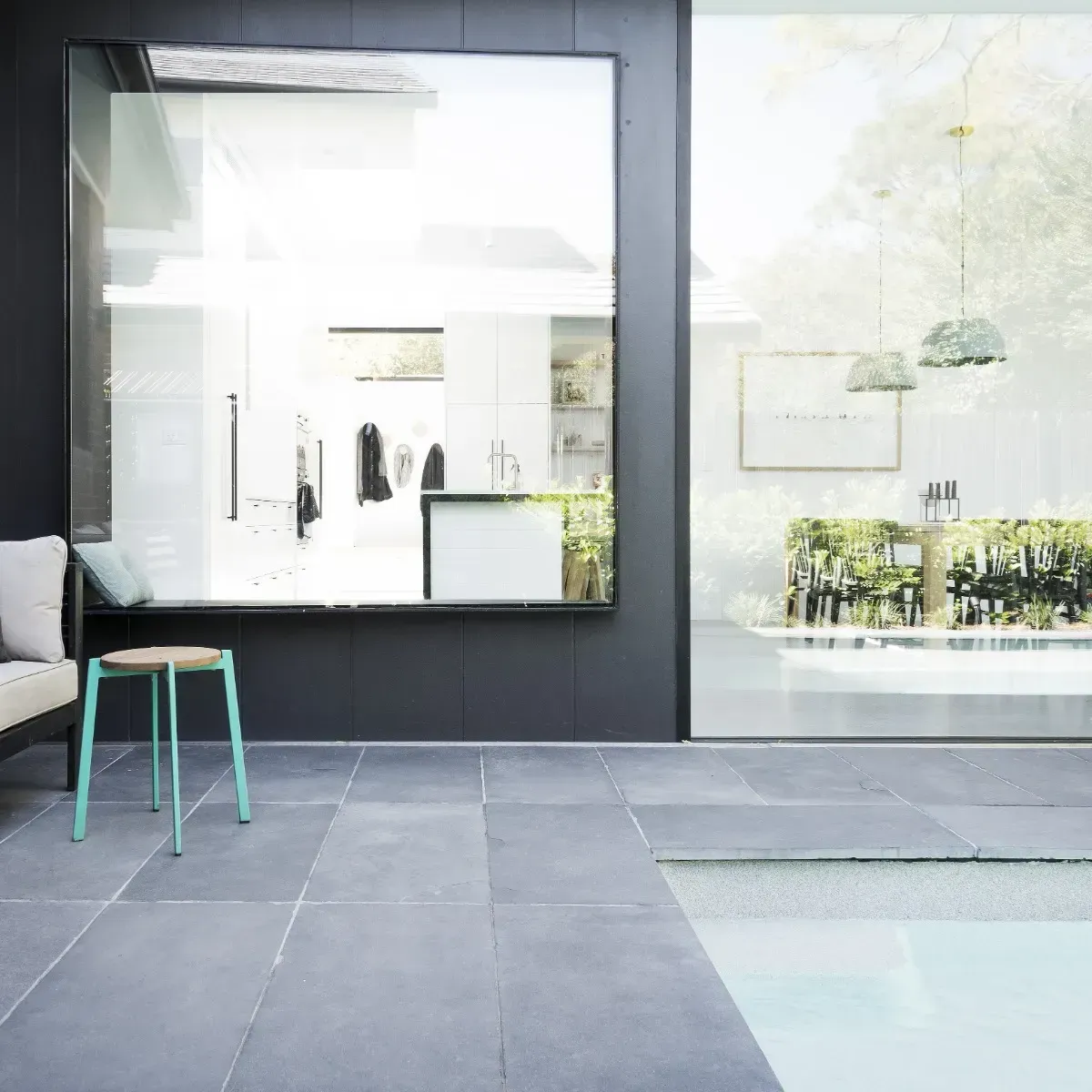 A  Poolside Patio With Grey Marble Tiles And A Stool— Amber North Coast In Port Macquarie, NSW