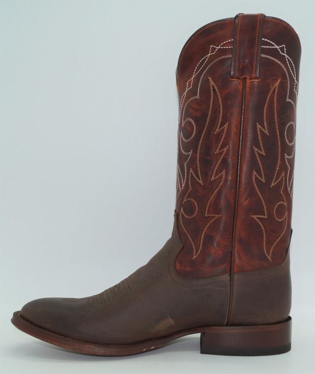A pair of brown cowboy boots on a white background