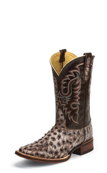 A pair of brown and white cowboy boots on a white background.