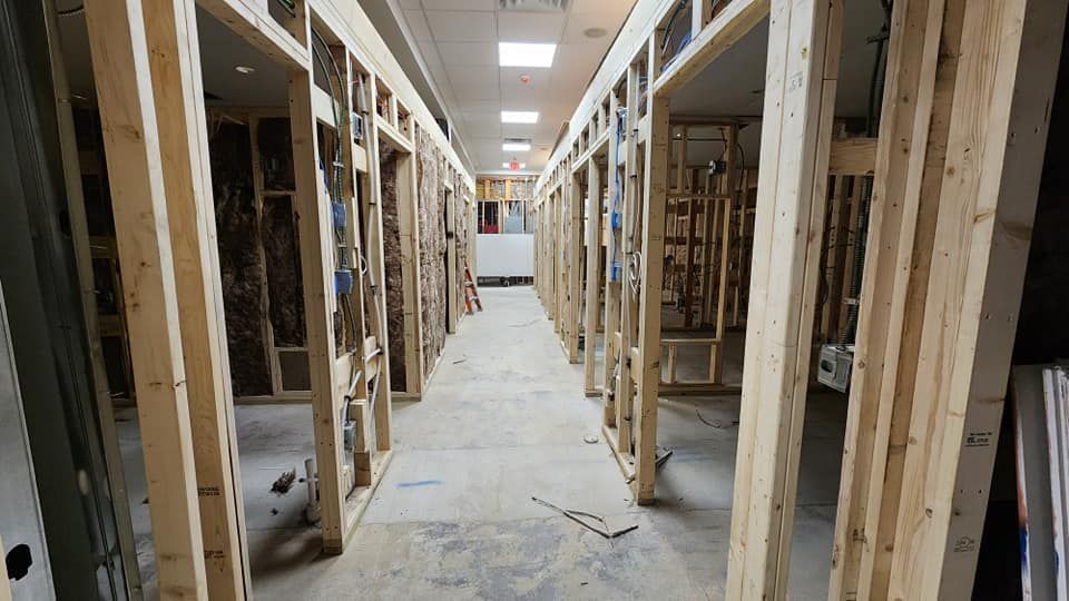 A long hallway with a lot of wooden beams.
