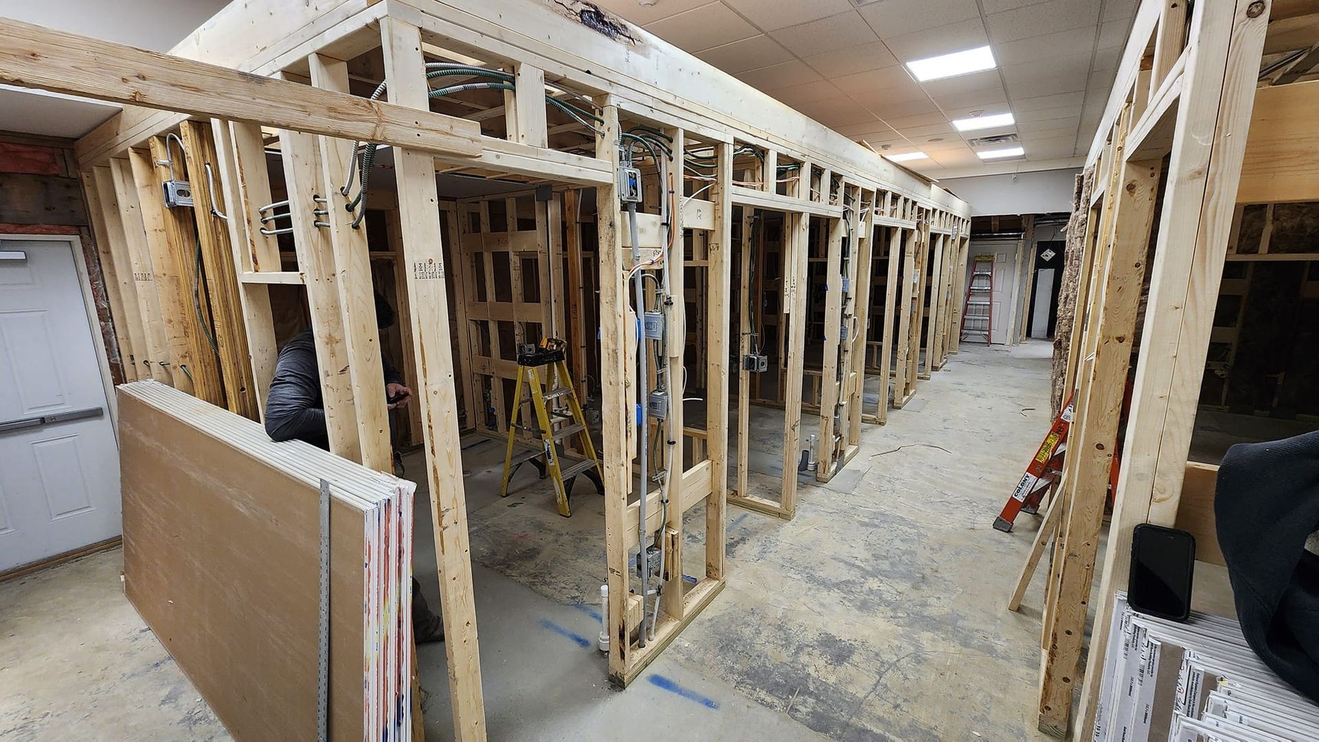 A large room with a lot of wooden frames in it.