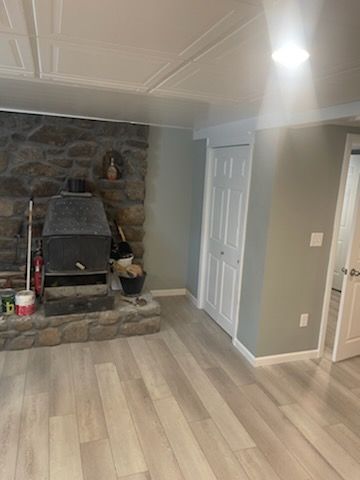 There is a fireplace in the middle of the room.