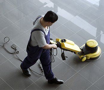 Man vacuuming the floor