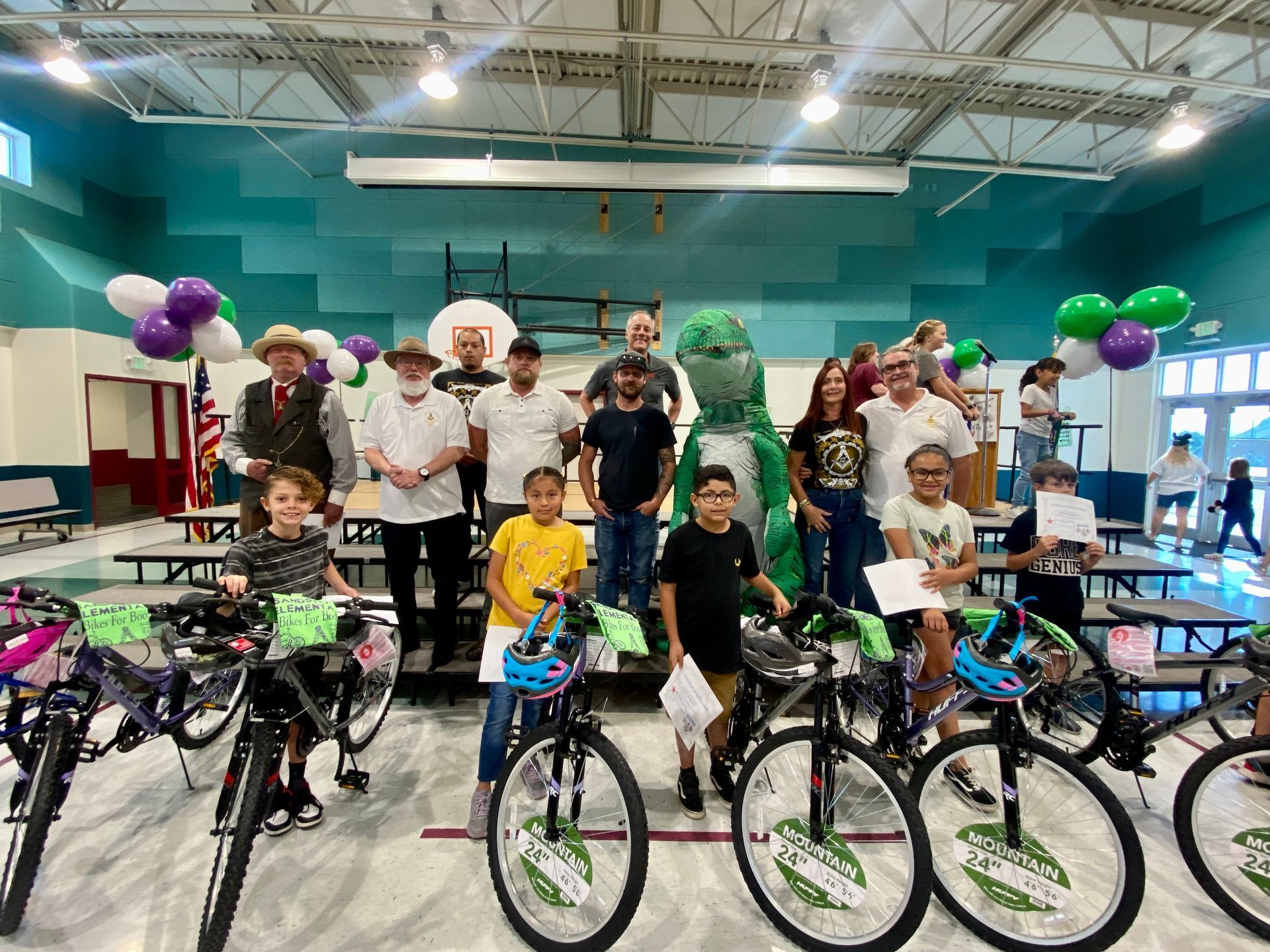 Bike Legal staff and Masonic Lodge of St. George Utah awarding bicycles to students at school