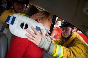 Two Firemen Helping Woman — Attorneys in Fall River, MA