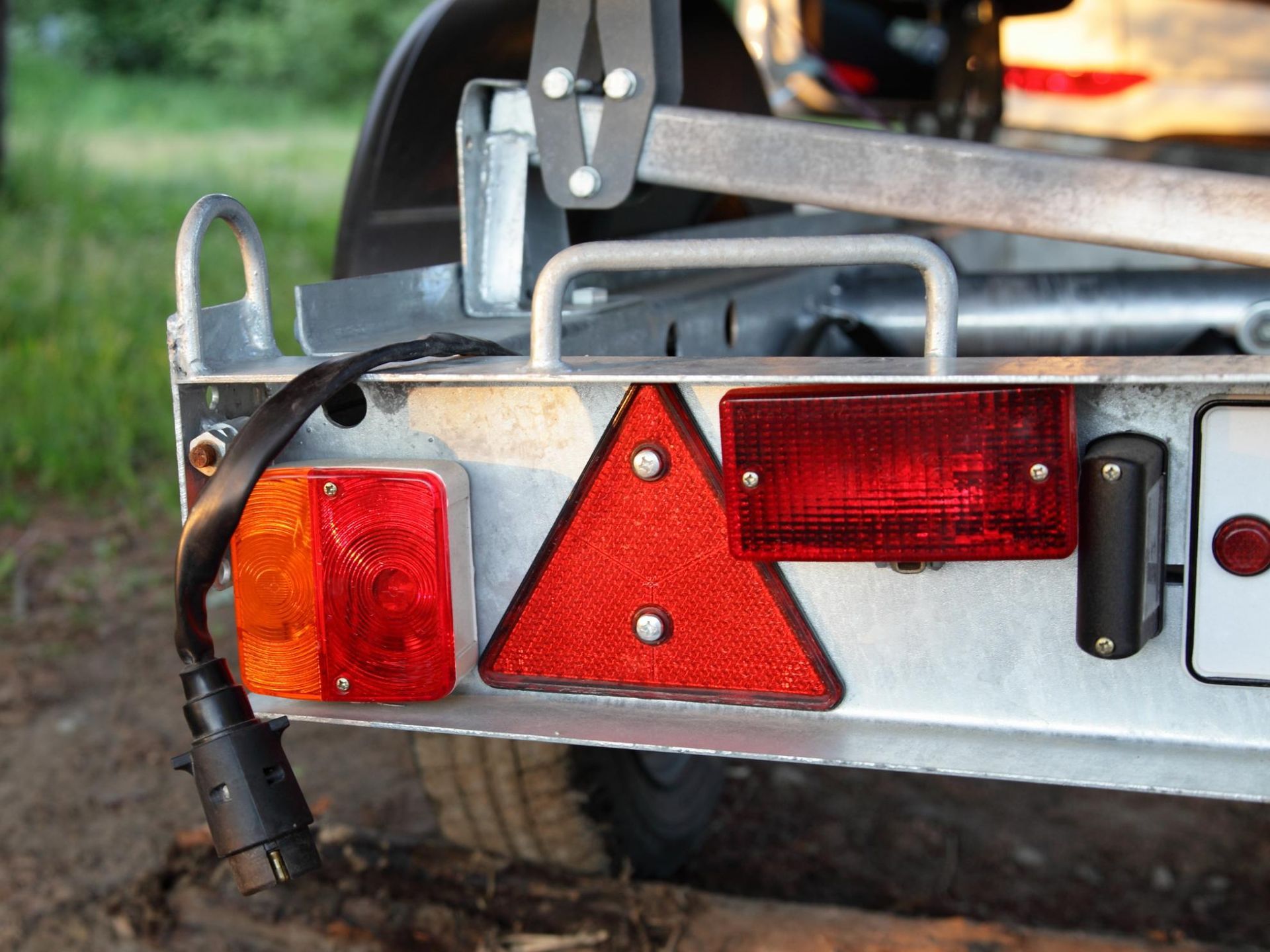 A close up of a trailer with a red light on it.