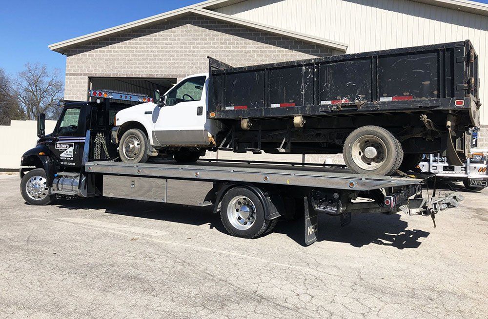 Black Truck is Being Towed — Green Bay, WI — Glenn’s 24hr Towing