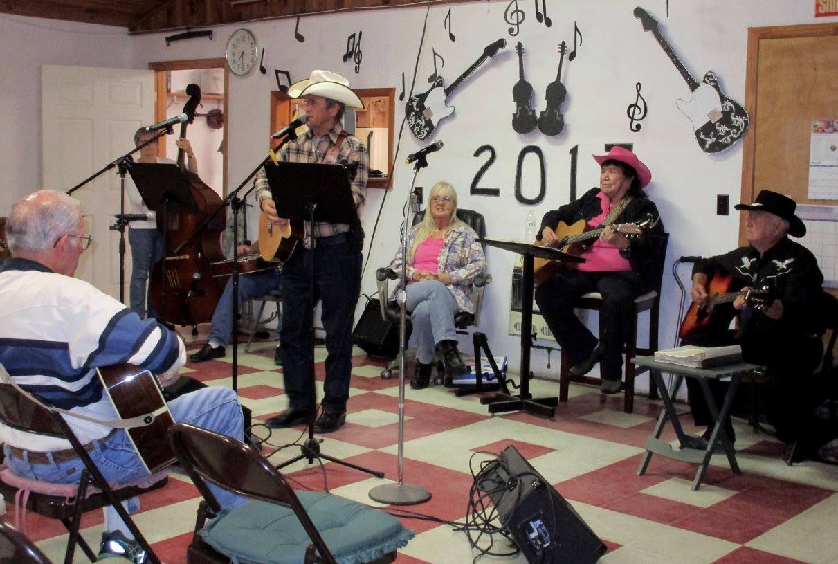 the year 2011 is on the wall behind the musicians