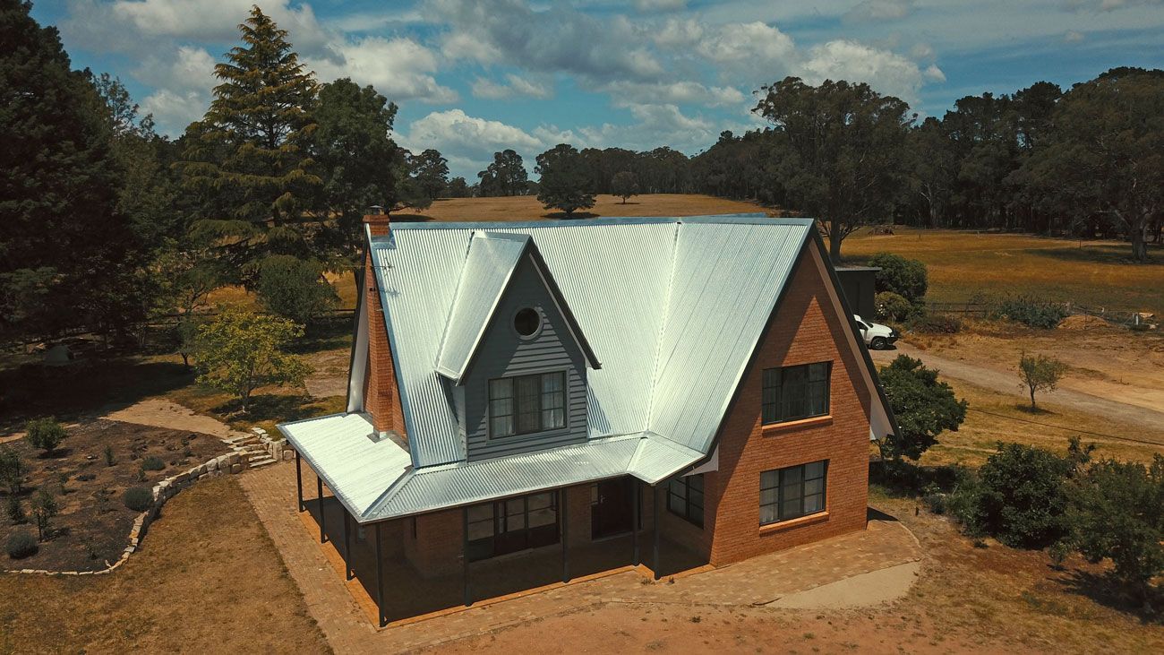 House with a Gray Metal Roof — Product Applications