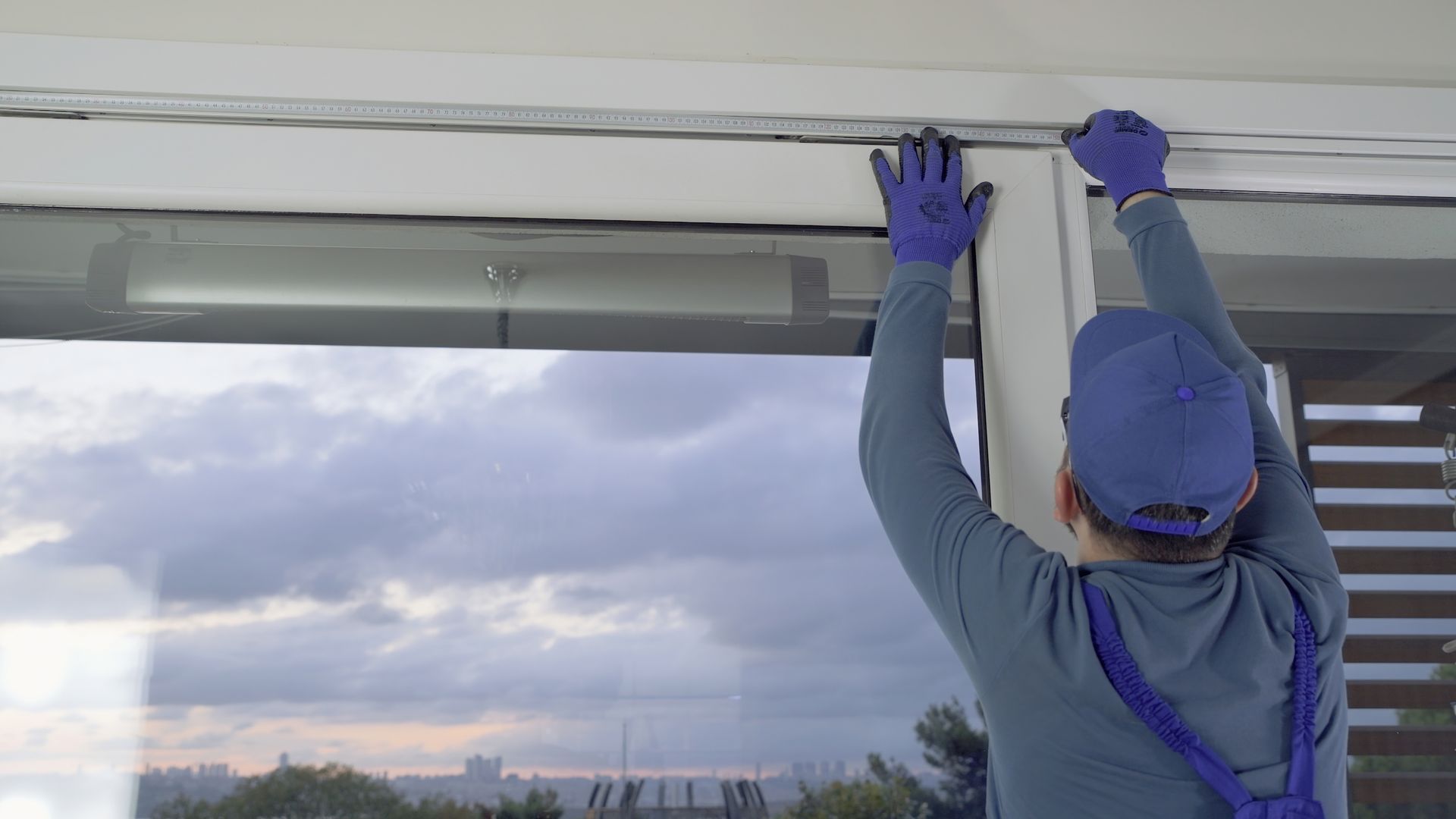 Experienced contractor working on window installation services.