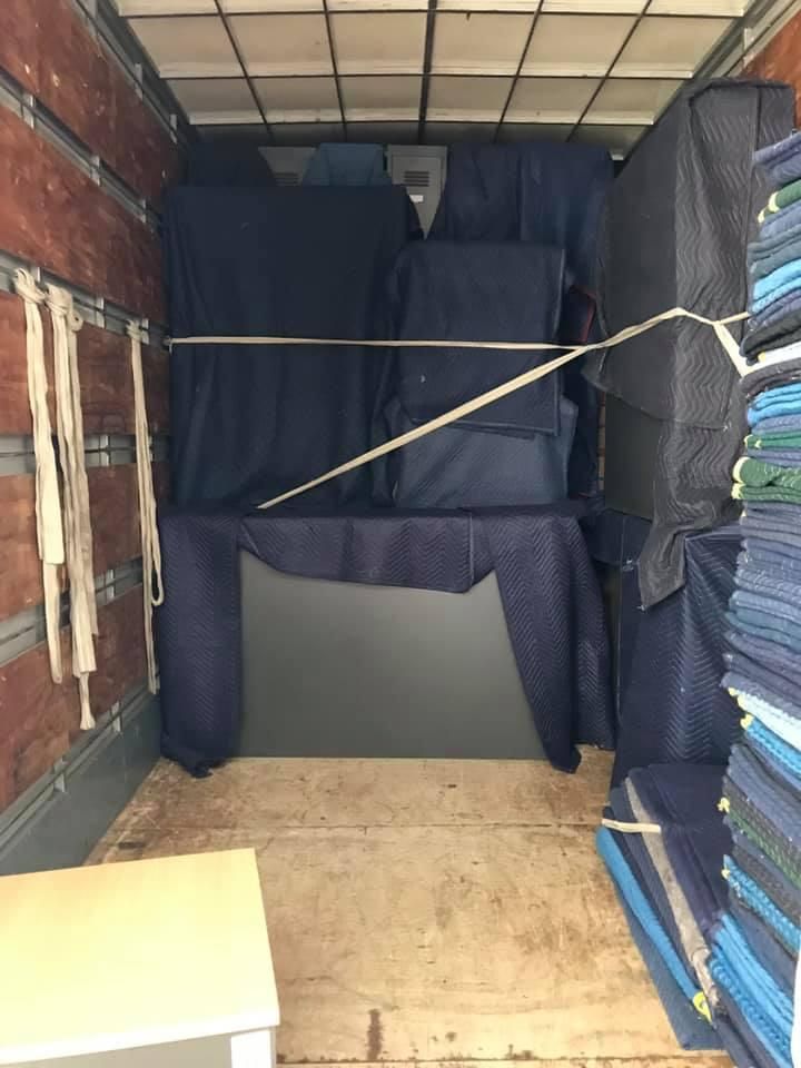 The Inside of a Moving Truck Filled With Furniture and Blankets — Wide Bay Removals In Dundowran, QLD