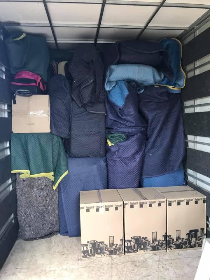 A Moving Truck is Filled With Lots of Blankets and Boxes — Wide Bay Removals In Dundowran, QLD