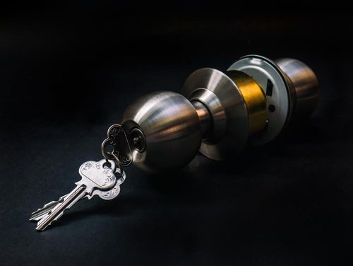 Door Lock With Keys Inserted — Locksmith In Bendigo, VIC