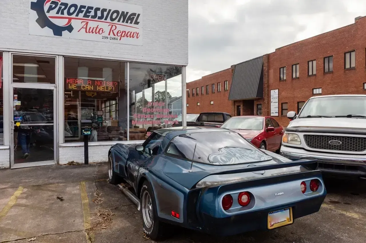 A Blue Car Is Parked in Front of a Professional Auto Repair Shop  | Professional Auto Repair