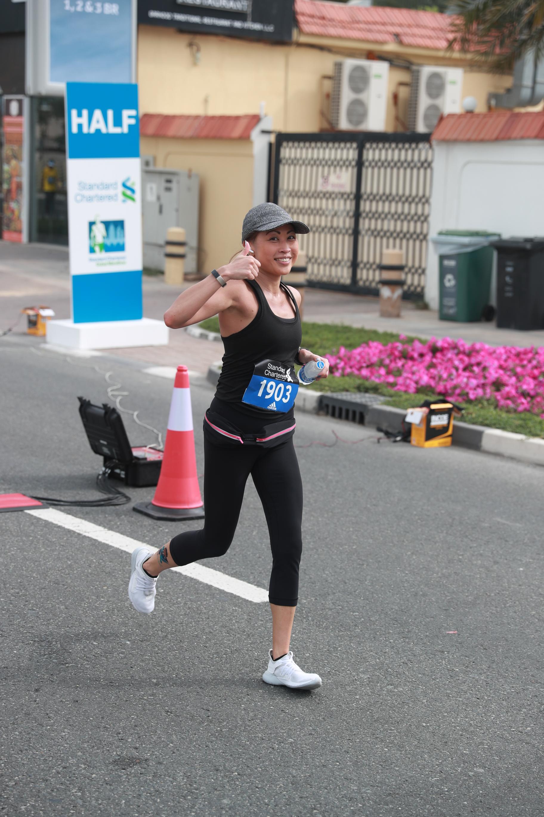 Carol Lafferty running a marathon after being cured of Lupus through Motiva Immuno Booster Curcumin Supplement