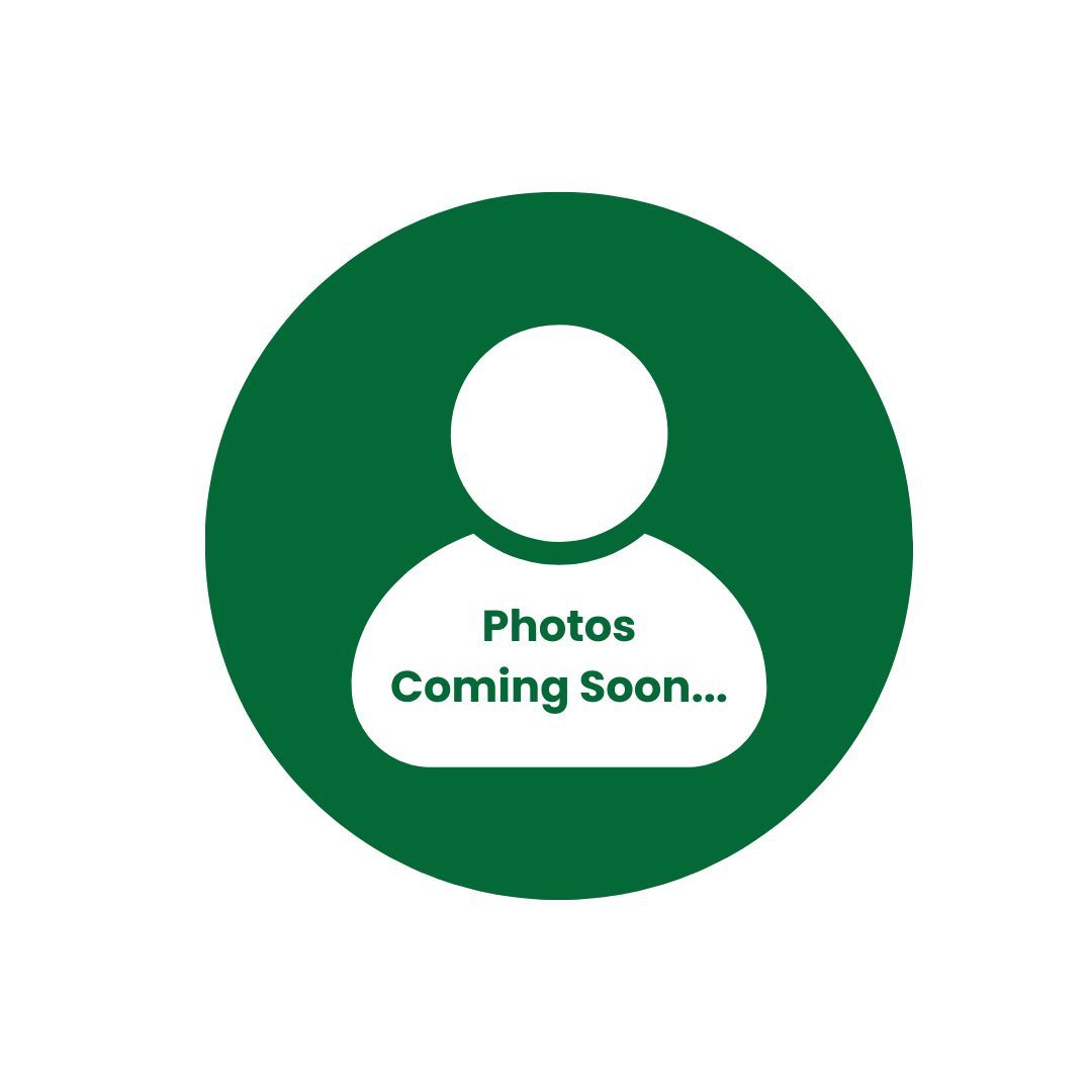 A woman in a white shirt and hoop earrings is looking at the camera with her arms crossed.