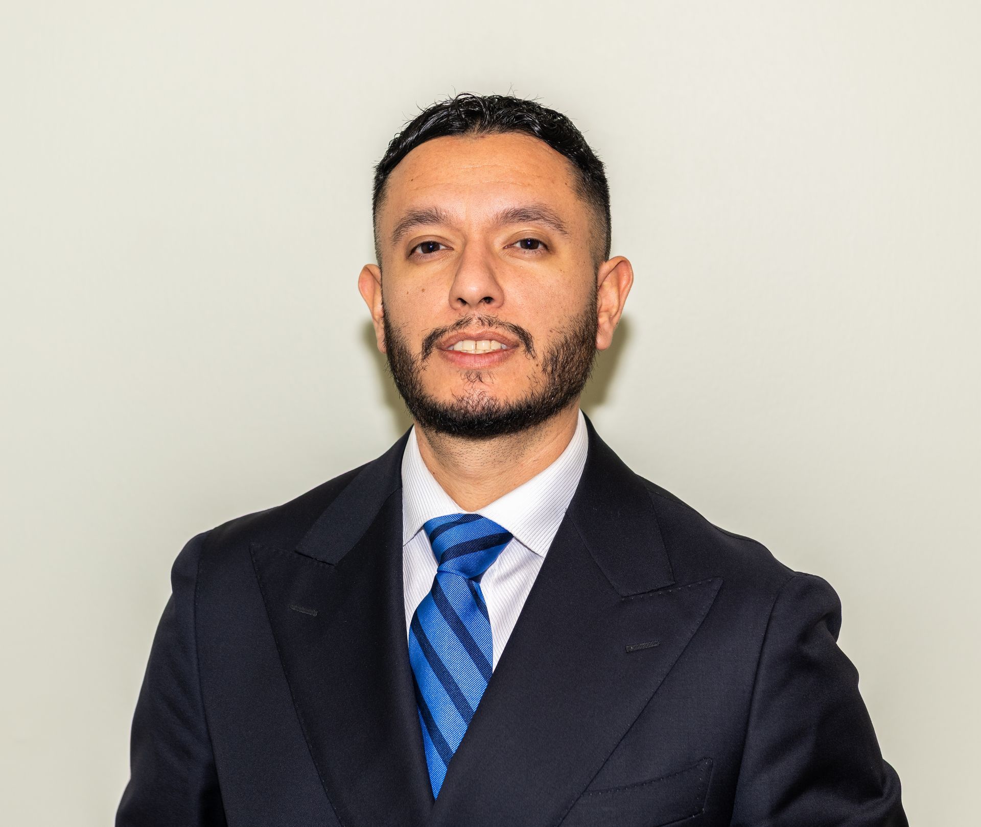 A woman in a white shirt is smiling for the camera.