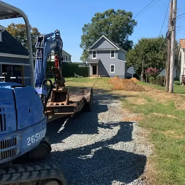 A blue excavator with 2650 on the side of it