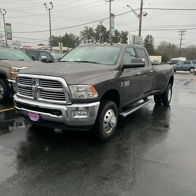 A dodge ram truck is parked in a parking lot