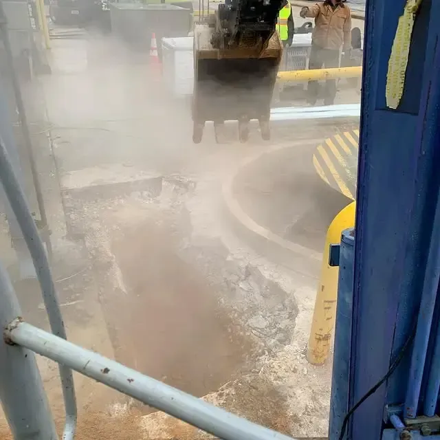 A bulldozer is digging a hole in the ground.