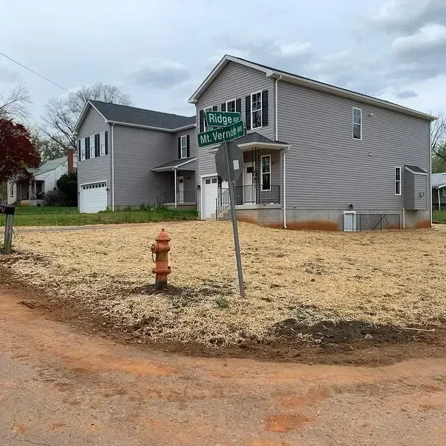 A house with a fire hydrant in front of it