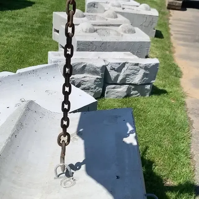 A chain is hanging from a concrete block