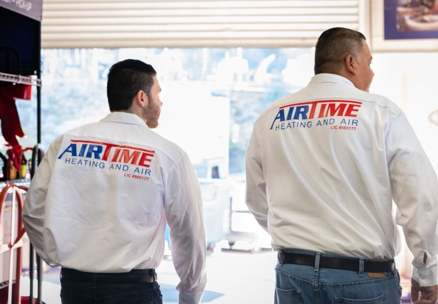 Airtime Heating & Air Conditioning technician servicing an HVAC unit, ensuring reliable home comfort