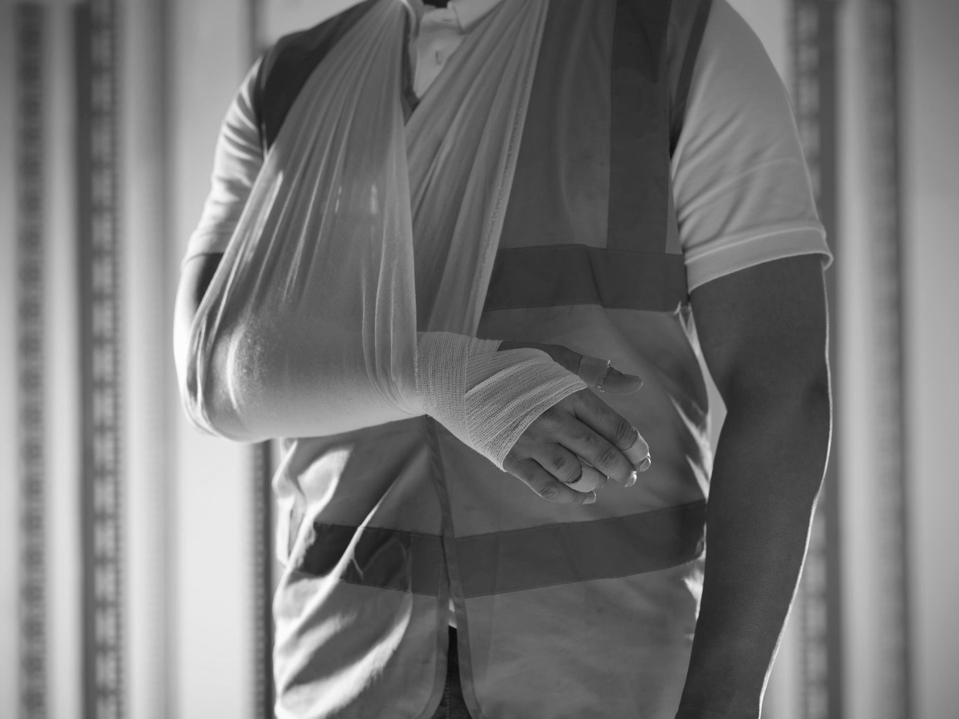 A construction worker with a cast on his arm.