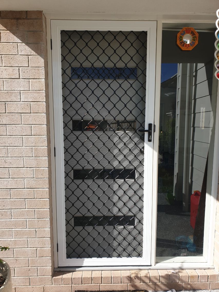 White and Black Diamond Grille Security Door — Security Screen Repairs in Gold Coast, QLD
