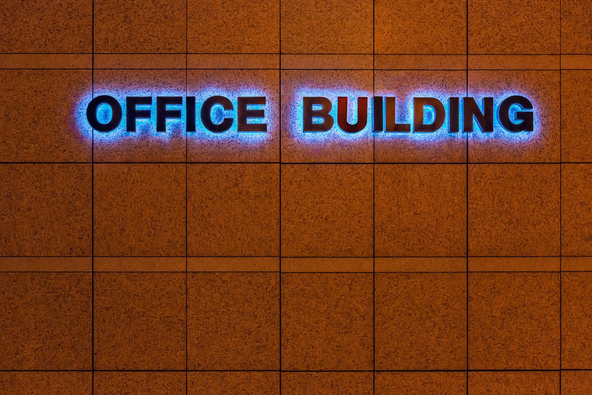 Exterior office building sign with illuminated lettering. Exterior office building sign with illuminated lettering.