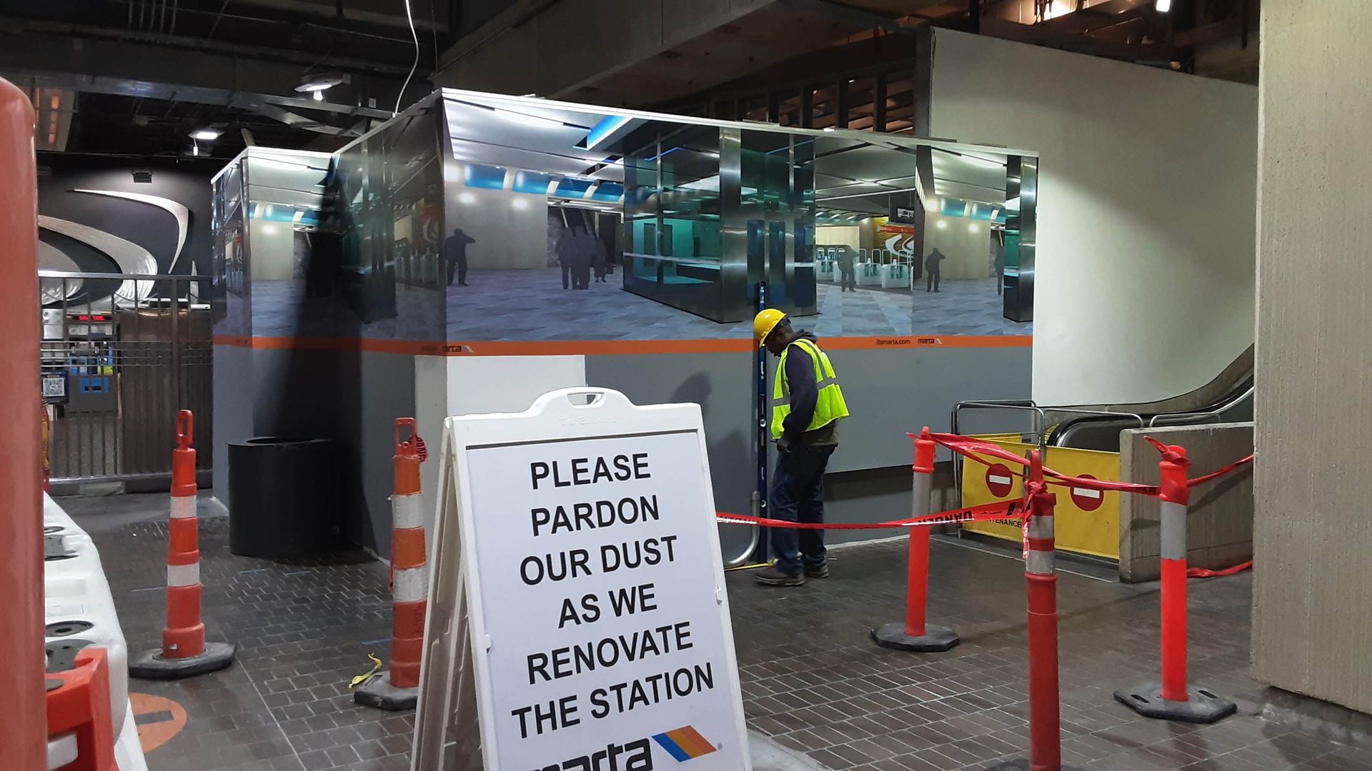 A sign that says please pardon our dust as we renovate the station