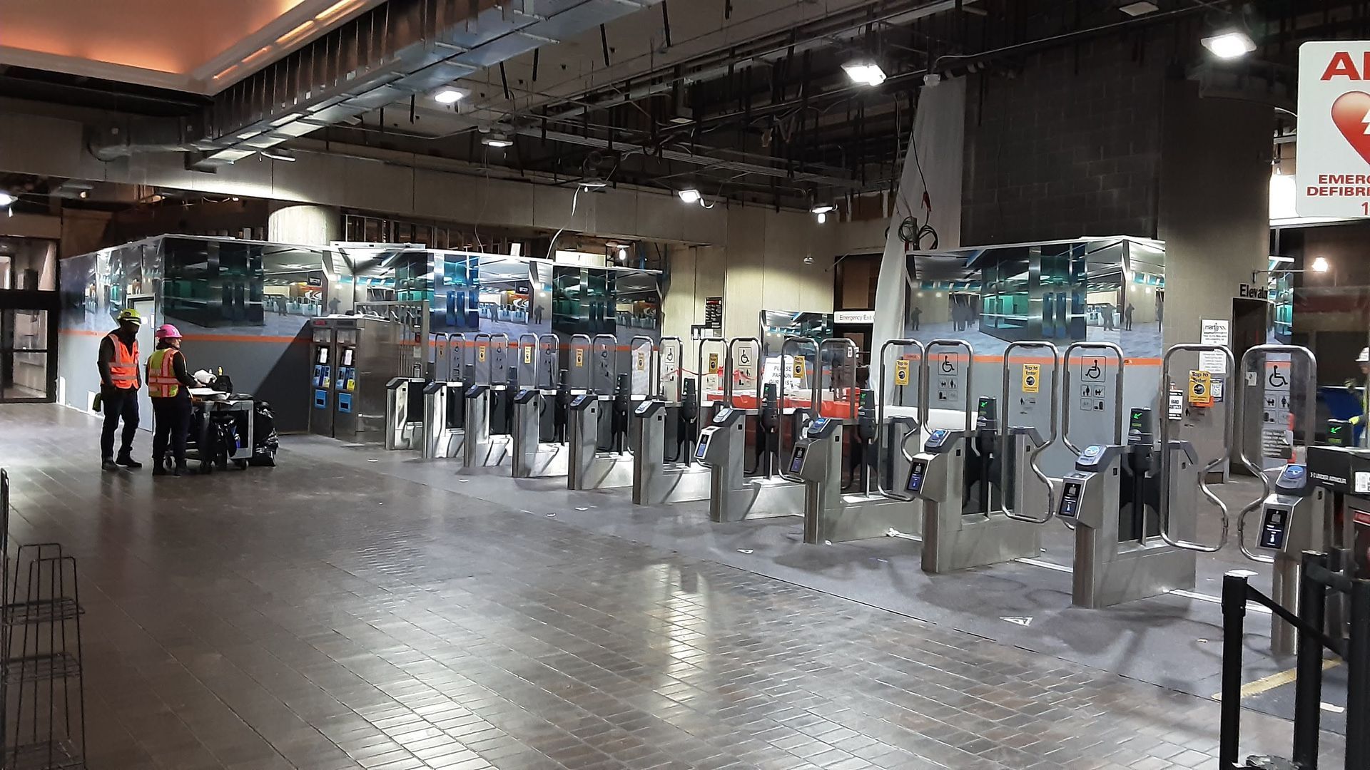 A subway station with a sign that says ambulance on it