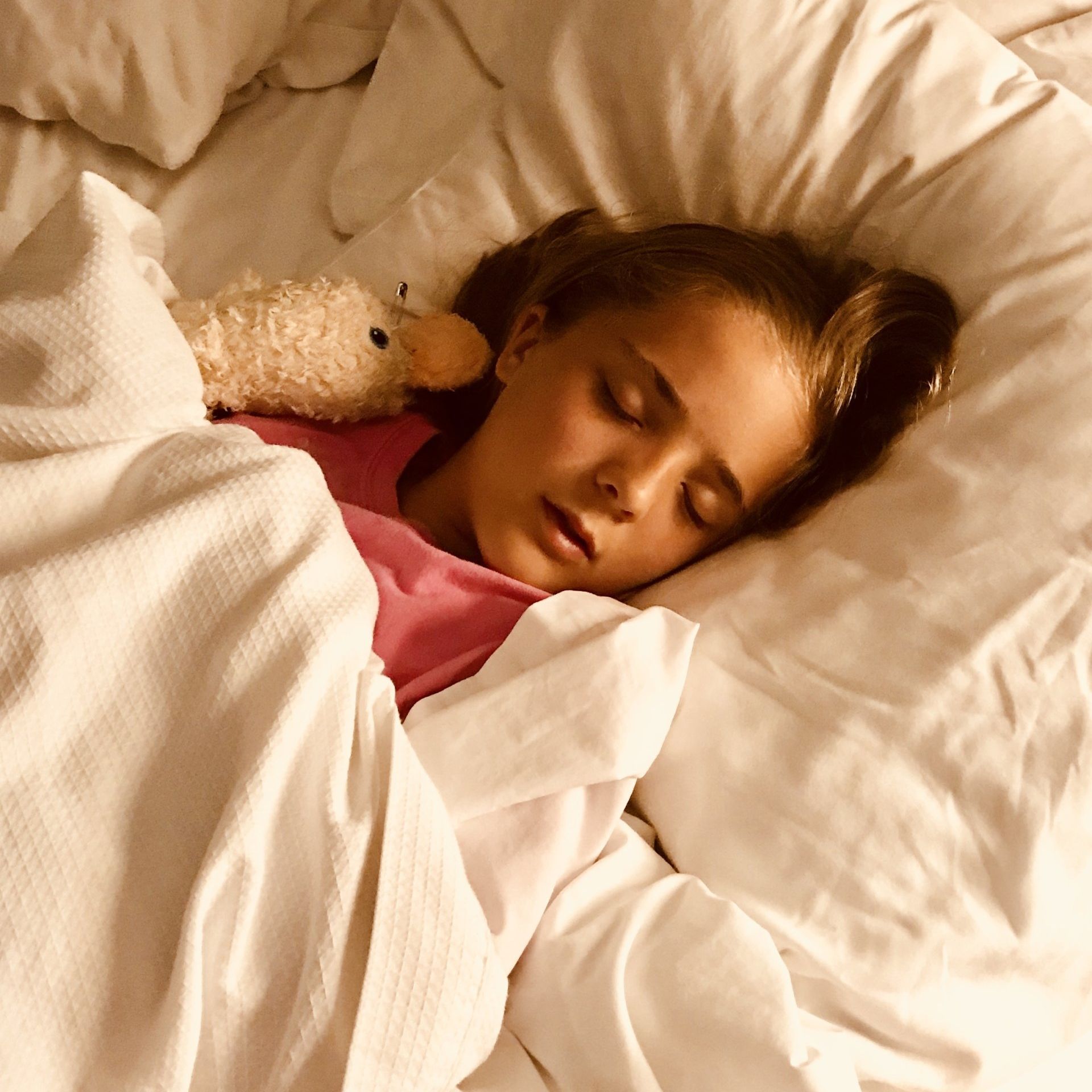 Image of child sleeping in bed.
