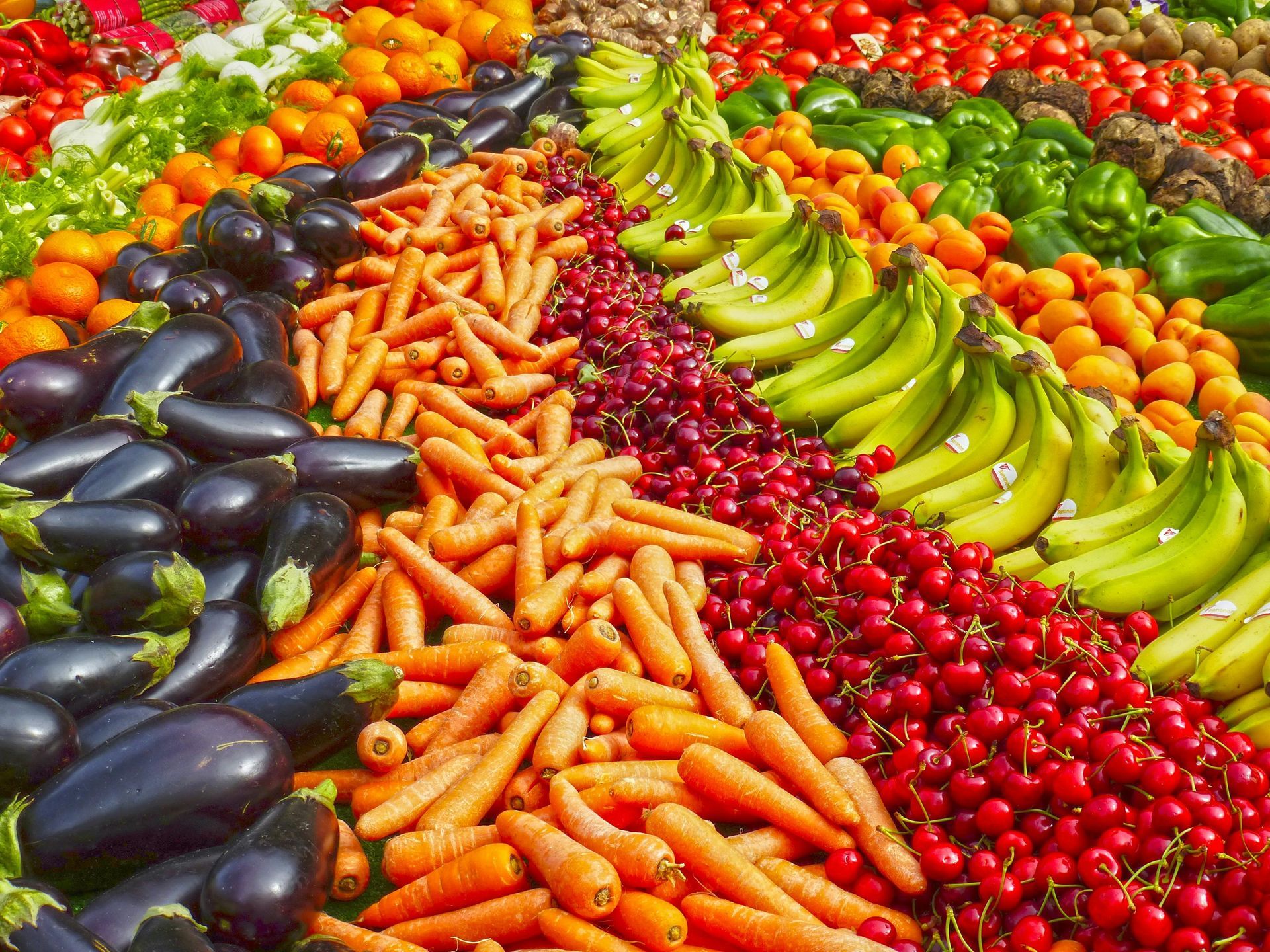 Beautiful image of rows of fresh fruits and vegetables.