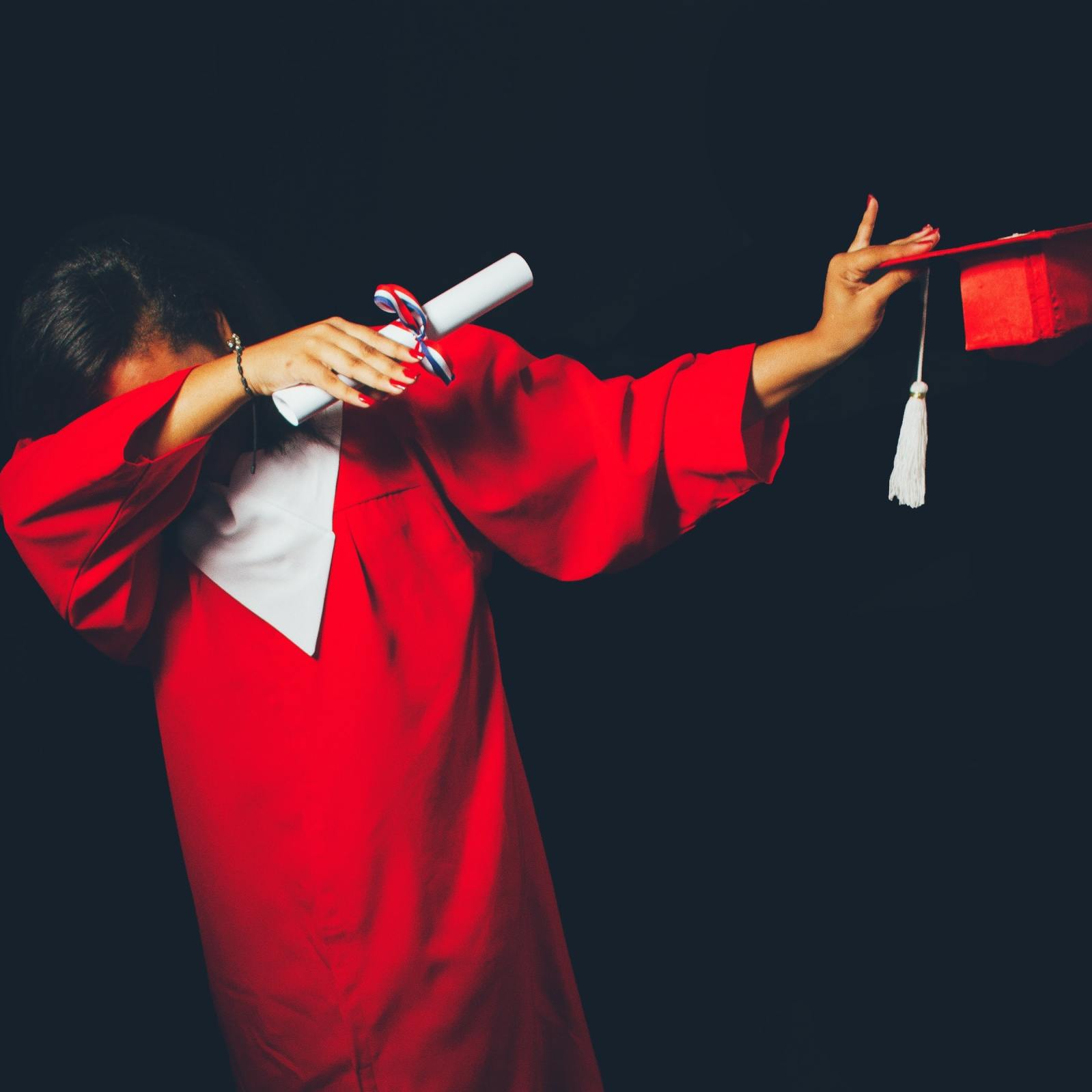 Image of high school graduate dabbing.