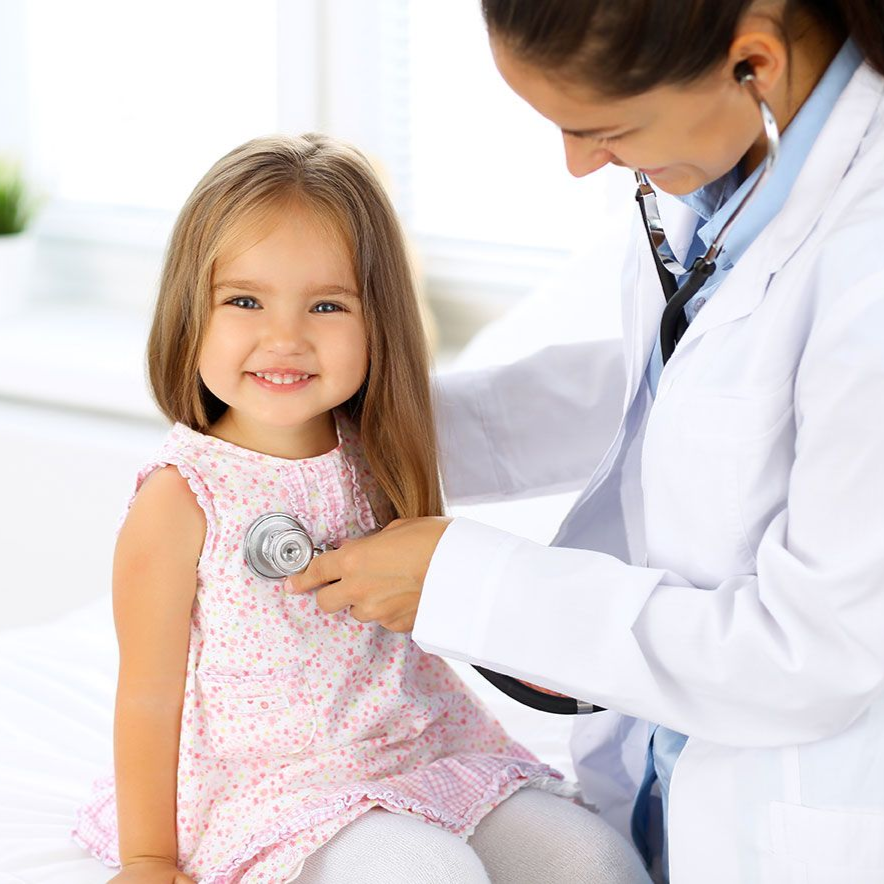 Image of a pediatrician using a stethoscope on a cute  toddler patient.