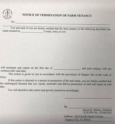 A notice of termination of farm tenancy is written on a piece of paper