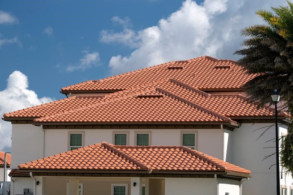 Roofing contractor replacing aging roofing materials on a residential property